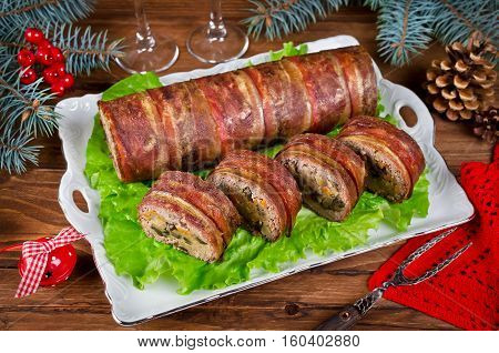 Oven Baked meatloaf with bacon mushrooms carrots onions and mashed potatoes. Christmas appetizer
