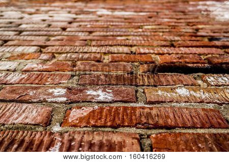 Brickwork. Grunge brick wall. Rough brick wall. Grunge brick background. Wet brick wall. Brick wall