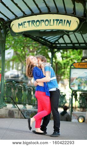 Young Romantic Couple Meeting Each Other Near Entrance To Metro Station