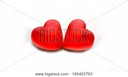 Little colorful candy hearts on white background.