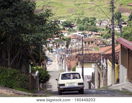 Old car down the slope in the Brazilian interior city.