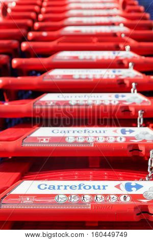 Macon, France - October 30, 2016: Carrefour shopping cart. Carrefour is a french multinational retailer headquartered in France and it is one of the largest hypermarket chains in the world