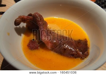 Premium Wagyu Japanese Beef in yolk bowl ready to eat