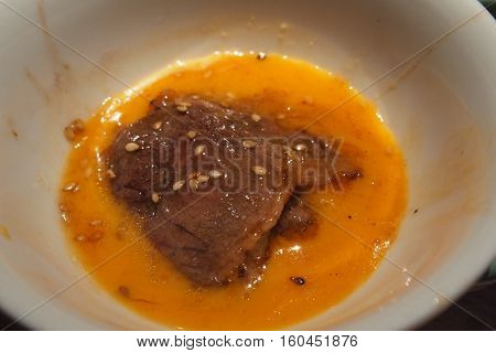 Premium Wagyu Japanese Beef in yolk bowl ready to eat