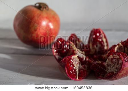 Pomegranate on a white background ripe pomegranate red pomegranate on a white background pomegranate seeds
