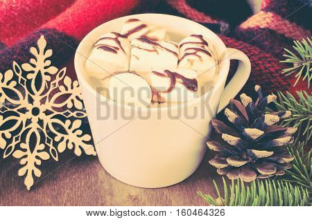 Hot Cocoa or coffee with marshmallows cones cozy warm blanket or plaid on wooden background. Winter New Year Christmas still life. Vintage Toned. Selective Focus.