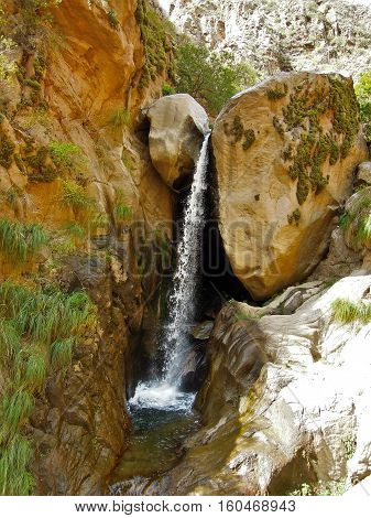 Long shot of a waterfall on the Cascadas del rio Colorado Trek close to Cafayate in Argentina South America