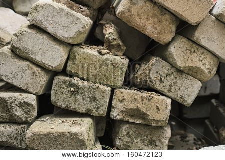 bricks from the destroyed house earthquake. destroyed building