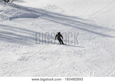 Skier on ski at sun winter day. Caucasus Mountains. Hatsvali Svaneti region of Georgia.