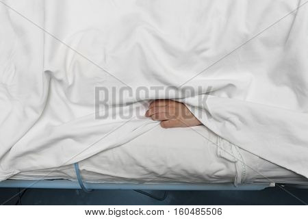 Hand of moribund patient in hospital. Death concept