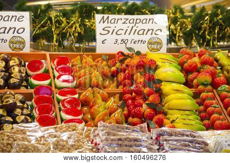 BERGAMO, ITALY - DECEMBER 1, 2016: Stall with marzipan sweets on Christmas market