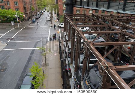 NEW YORK CITY - MAY 1 2016: Due to lack of space cars are parked on elevated parking places in Chelsea a neighbourhood in Manhattan