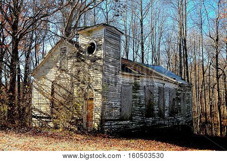 Pittsboro North Carolina - December 7 2016: Delapidated ruins of an abandonned wooden church on Route 15-501 near Bynum