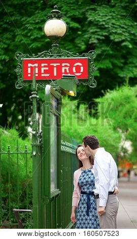 Beautiful Couple Is Kissing Near The Metro Station In Paris