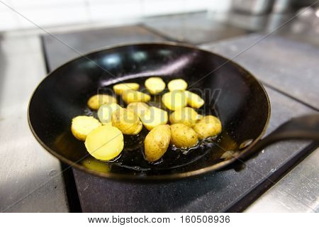 Bebbi-potatoes Fried In A Pan In The Restaurant.