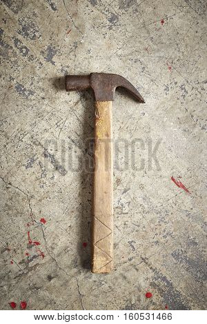 Hammer isolated on concrete background texture oriented, carpentry, industry,