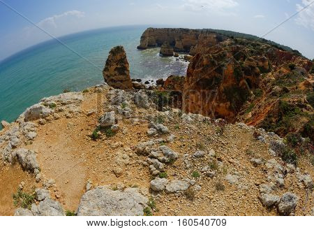 Fisheye view of scenic Praia da Marinha beach in Portugal