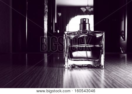 Perfume for men in a glass bottle close-up.