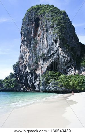 karst rock formations tower over railay beach in krabi southern thaiand
