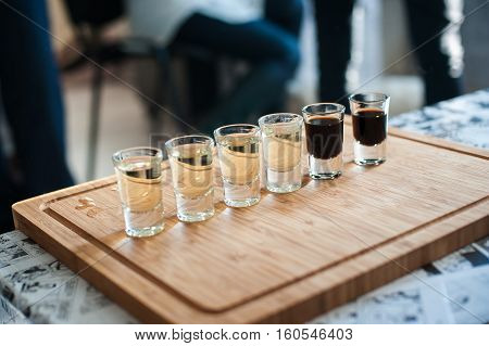 Brandy In Shot Glasses Lined Up In A Row