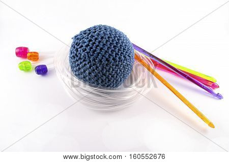 Tunisian crochet hook and juggling ball isolated on white background