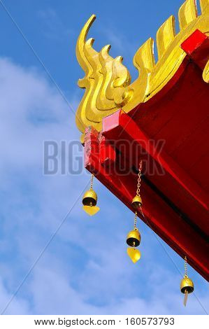 Art decorates the roof of a Buddhist temple in Thailand.