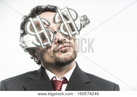 Greed and money, businessman with dollar-shaped glasses, elegant tie suit