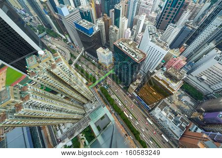 Skyscrapers, buildings, road in Hong Kong city, China at sunny day, top view from China Resources Building
