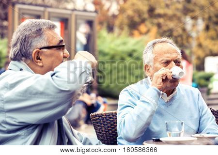 Senior friends enjoying city early in the morning.