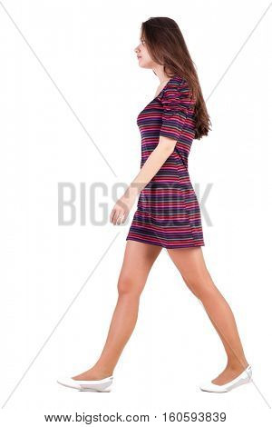 back view of walking  woman in dress. beautiful brunette girl in motion. backside view of person. Rear view people collection. Isolated over white background. Sad brunette goes past us 