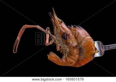 Burn Shrim And Seafood Sauce On Black Background.