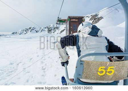 Skier getting of the lift. Preparing for a ride.
