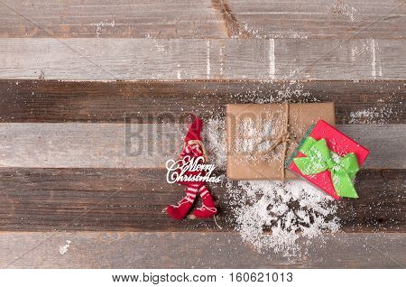 Christmas decoration and christmas gift on wooden background