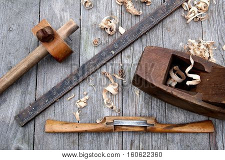 Antique Vintage Ruler, Spokeshave, Mortise Gauge And Block Plane Woodwork Tools On Weathered Wood Ba