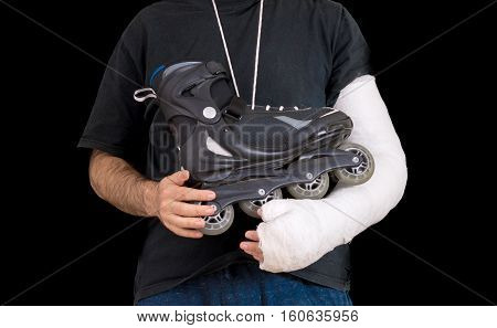 Young Man Wearing An Arm Cast After A Skating Accident