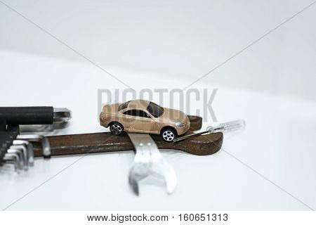 Abstract composition of broken car and repair process.