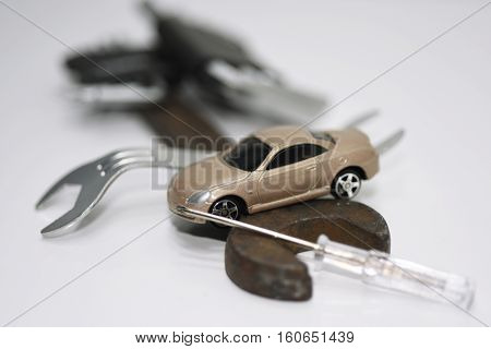 Abstract composition of broken car and repair process.