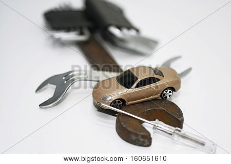 Abstract composition of broken car and repair process.