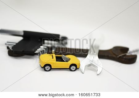 Abstract composition of broken car and repair process.