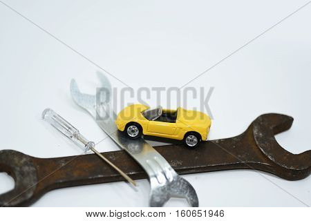 Abstract composition of broken car and repair process.