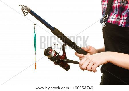 Fishing equipment concept. Woman holding fishing rod with green float. Isolated background.