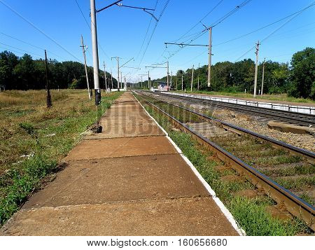 Double-track railway runs past the stopping point of the apron.
