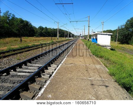 Double-track railway runs past the stopping point of the apron.