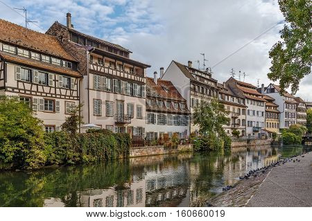 Historic houses on the embankment of the Ill river in Petite France district in Strasbourg France
