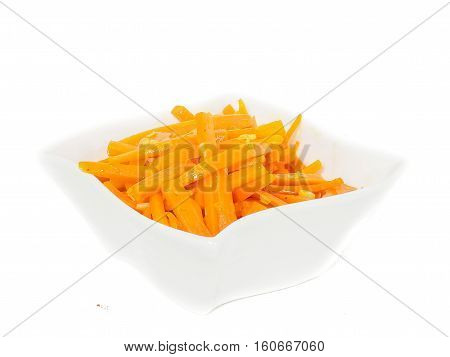 Closeup Of Carrot Cut Into Julienne Slizes In A Beautiful White Bowl Against White