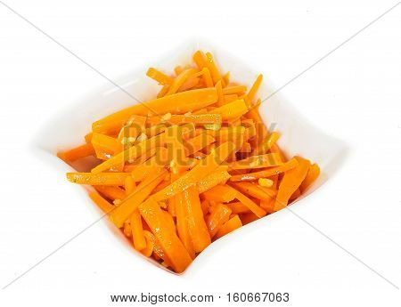 Closeup Of Carrot Cut Into Julienne Slizes In A Beautiful White Bowl Against White