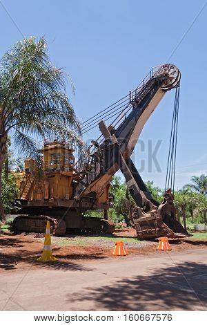 Excavator in front of the entrance of the former iron mines in Thabazimbi, Limpopo, South Africa