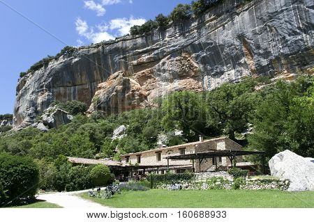 Buoux France - June 26 2007: cyclists eat in restaurant of Auberge under the cliffs of the buoux fort France. Auberges are rural Inns typically with restuarants in rural France.