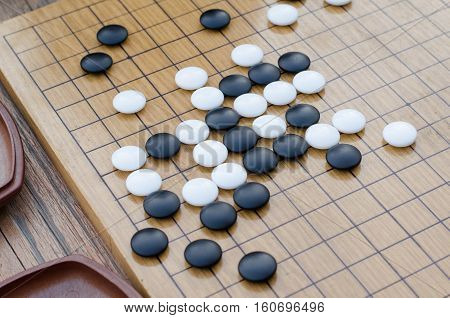 Chinese board game go with black and white stones