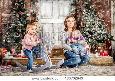 Happy family with mother and young daughters